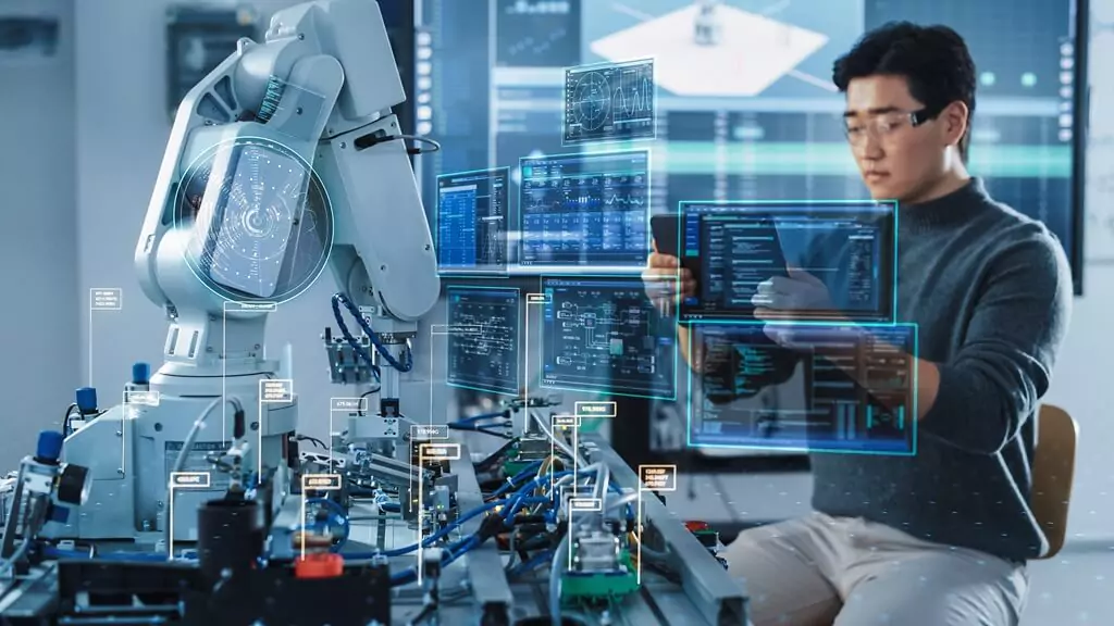 rapaz controlando robô com tablet